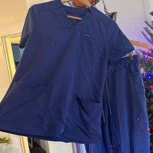 Jaanuu scrub set size small. I believe the color is galaxy blue, or close to it!